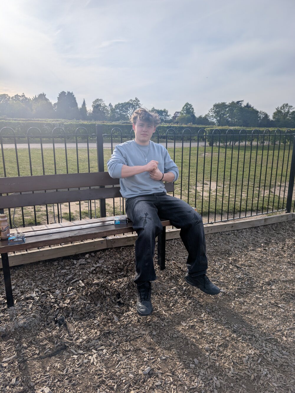 Alex Filios seated, surveying his nation